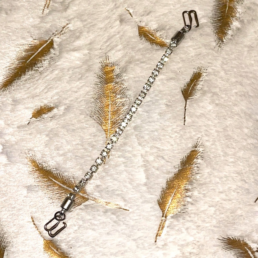 Silver with diamond flecks tennis bracelet (either Zales or Kay).